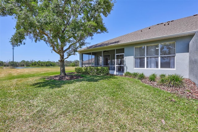 view of yard with a sunroom