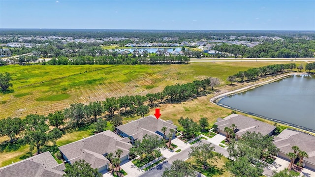 drone / aerial view featuring a water view and a residential view