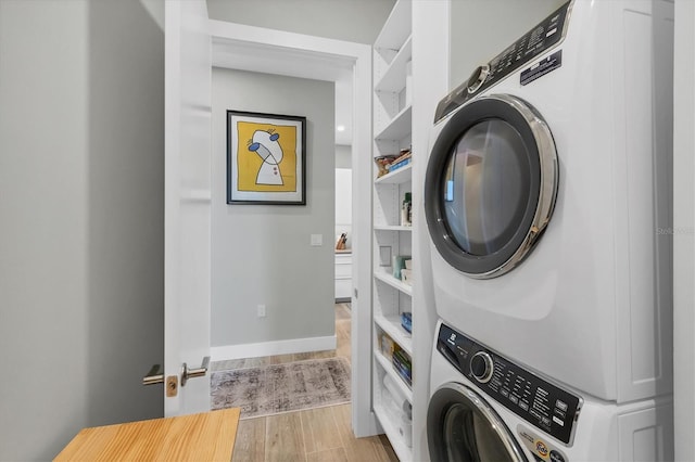 33 S Palm Ave Unit 1403, Sarasota, FL 34236 - laundry area featuring stacked washing maching and dryer, laundry area, and wood finished floors
