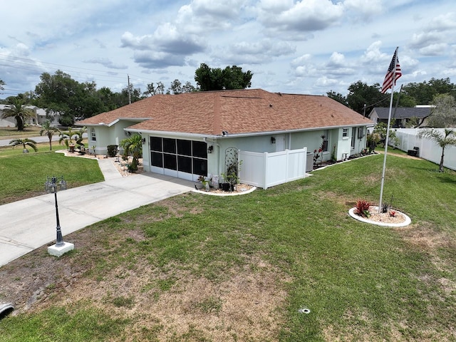 3984 Holin Ln, North Port, FL 34287 - exterior space featuring a front lawn, fence, and driveway