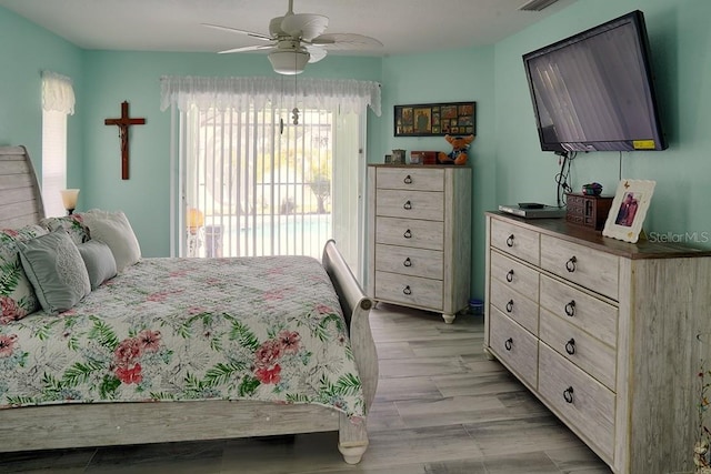 3984 Holin Ln, North Port, FL 34287 - bedroom featuring light wood finished floors, visible vents, access to outside, and a ceiling fan
