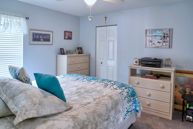 3984 Holin Ln, North Port, FL 34287 - bedroom featuring carpet floors, a ceiling fan, and a closet