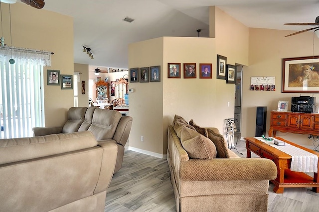 3984 Holin Ln, North Port, FL 34287 - living room featuring ceiling fan, lofted ceiling, visible vents, and wood finished floors