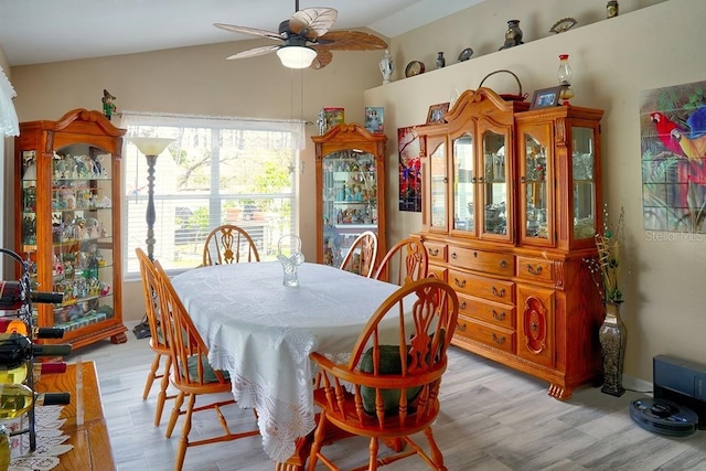 3984 Holin Ln, North Port, FL 34287 - dining room featuring lofted ceiling, a ceiling fan, and light wood-style floors