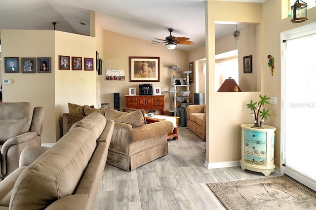 3984 Holin Ln, North Port, FL 34287 - living area featuring vaulted ceiling, baseboards, a ceiling fan, and a healthy amount of sunlight