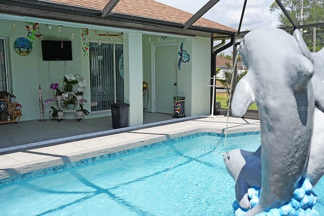 3984 Holin Ln, North Port, FL 34287 - outdoor pool featuring a patio area and glass enclosure