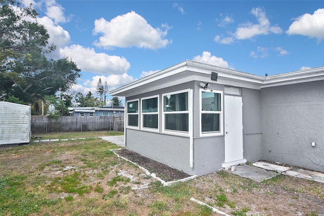 view of side of property with fence
