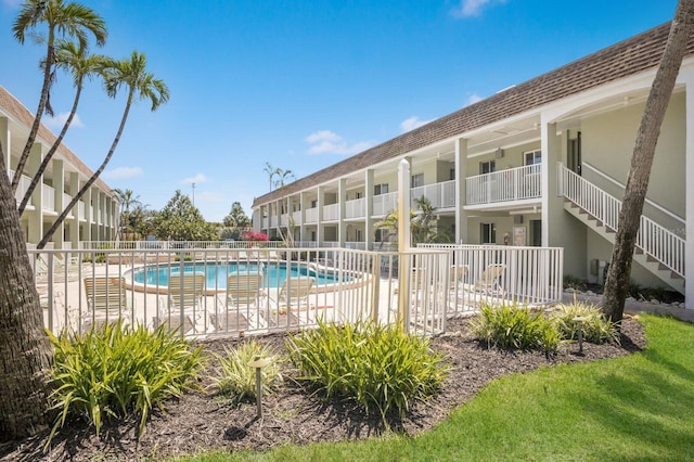 community pool featuring fence