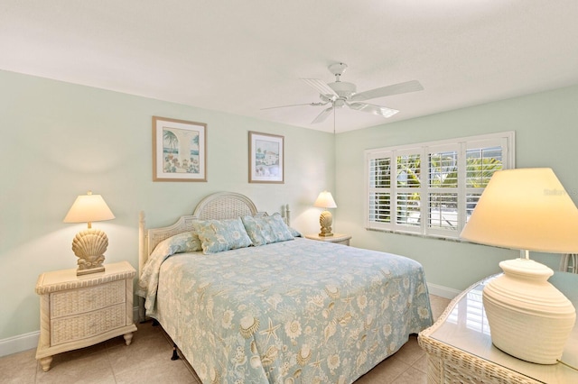 bedroom with baseboards, tile patterned floors, and a ceiling fan