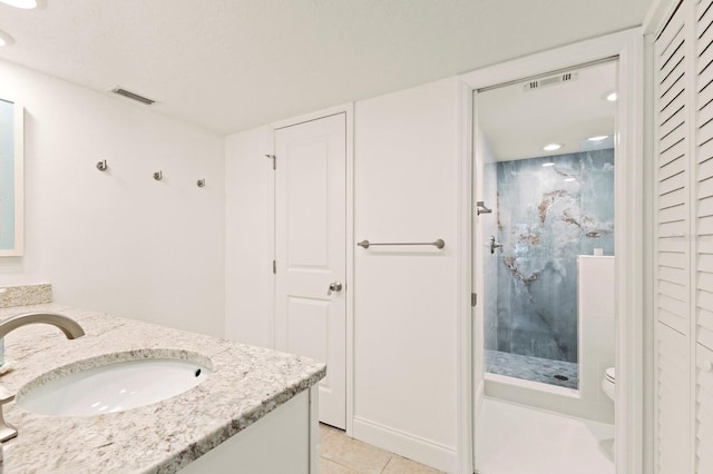 full bathroom with a stall shower, tile patterned floors, vanity, toilet, and recessed lighting