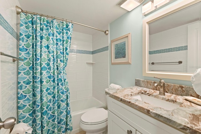 bathroom with shower / bathtub combination with curtain, vanity, and toilet