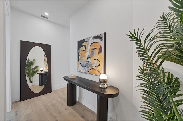 foyer entrance featuring light wood finished floors and recessed lighting