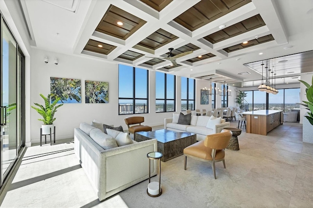 living room with coffered ceiling, beam ceiling, and recessed lighting