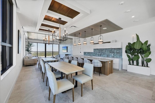 dining space with a chandelier and wood ceiling