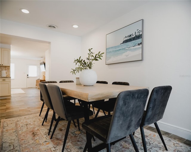 2300 Stratford Dr, Sarasota, FL 34232 - dining space with baseboards, light wood finished floors, and recessed lighting