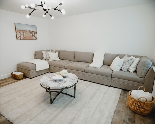 2300 Stratford Dr, Sarasota, FL 34232 - living area featuring wood finished floors, a chandelier, and baseboards