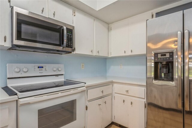 3610 54th St W Unit B4, Bradenton, FL 34209 - kitchen with appliances with stainless steel finishes, light countertops, and white cabinets