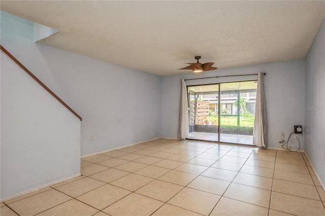 3610 54th St W Unit B4, Bradenton, FL 34209 - spare room with a ceiling fan, light tile patterned floors, and baseboards