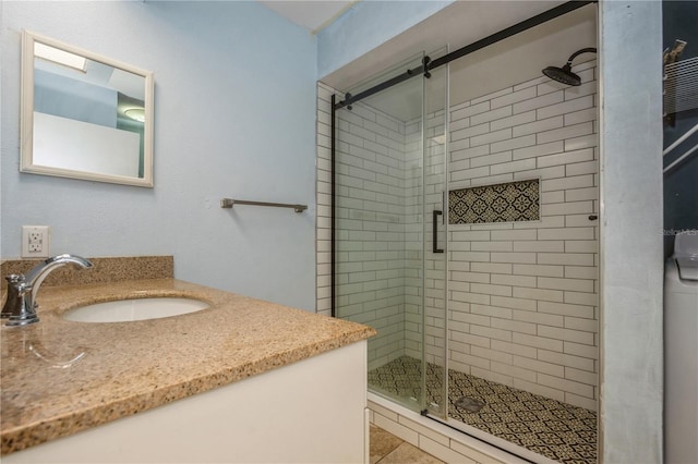 3610 54th St W Unit B4, Bradenton, FL 34209 - full bathroom featuring a stall shower, vanity, and tile patterned floors