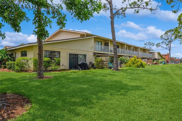 3610 54th St W Unit B4, Bradenton, FL 34209 - back of house with a lawn and stucco siding
