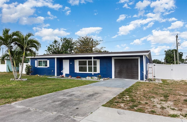 3095 Pinetree St, Port Charlotte, FL 33952 - ranch-style house with an attached garage, concrete driveway, and a gate