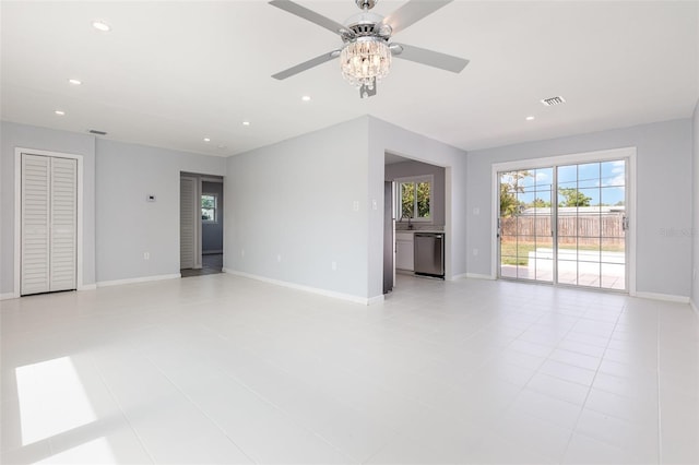 3095 Pinetree St, Port Charlotte, FL 33952 - unfurnished living room with a ceiling fan, baseboards, recessed lighting, and light tile patterned floors