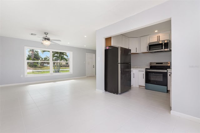 3095 Pinetree St, Port Charlotte, FL 33952 - kitchen with stainless steel appliances, open floor plan, baseboards, light countertops, and ceiling fan