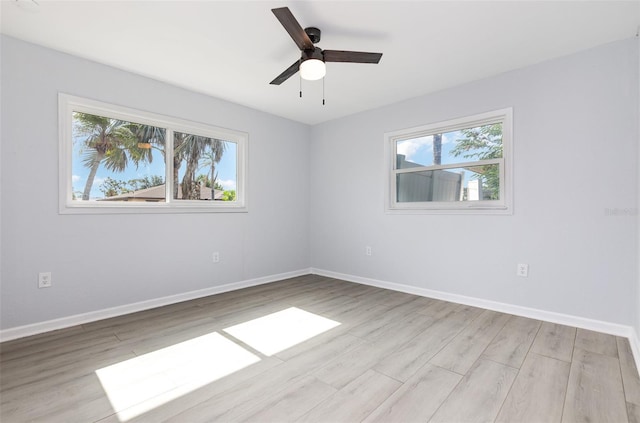 3095 Pinetree St, Port Charlotte, FL 33952 - spare room featuring wood finished floors, baseboards, and a ceiling fan