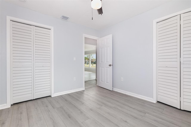 3095 Pinetree St, Port Charlotte, FL 33952 - unfurnished bedroom with wood finished floors, baseboards, and a ceiling fan
