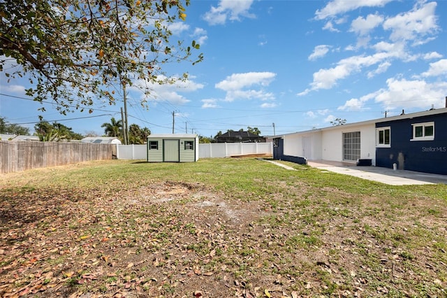 3095 Pinetree St, Port Charlotte, FL 33952 - view of yard featuring a patio, a storage unit, and an outdoor structure