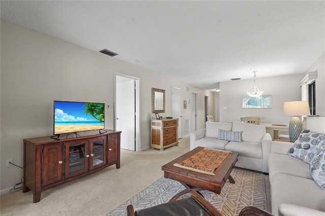 living area with light colored carpet and baseboards