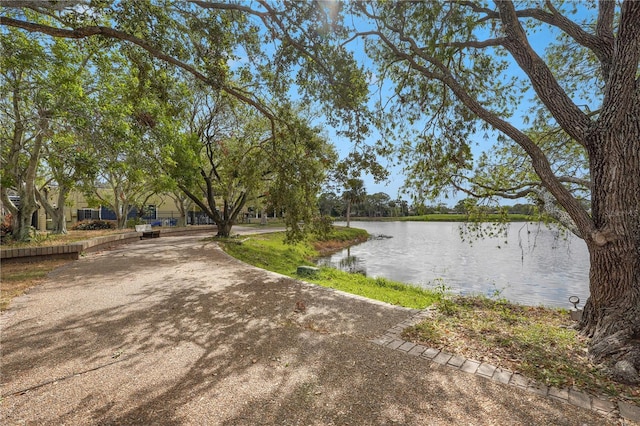 surrounding community featuring a water view
