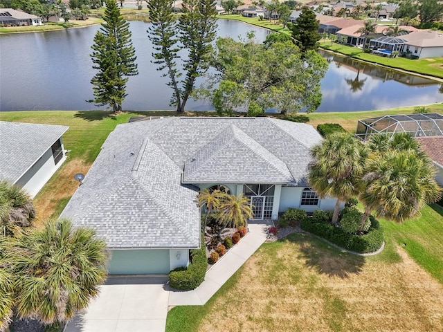 aerial view of residential area with a large body of water