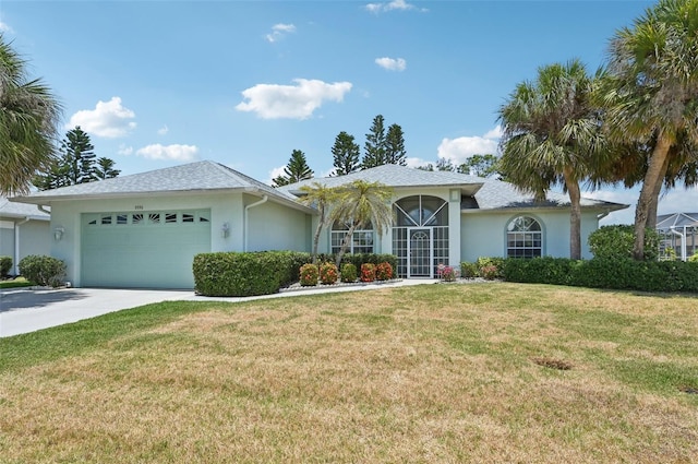 single story home featuring stucco siding, an attached garage, a front lawn, and concrete driveway
