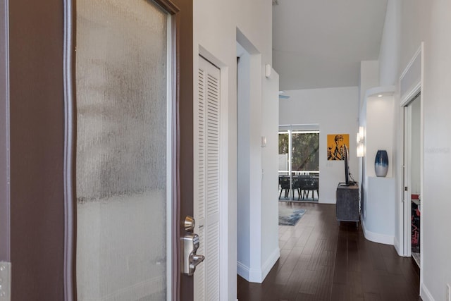 entrance foyer featuring wood-type flooring and baseboards