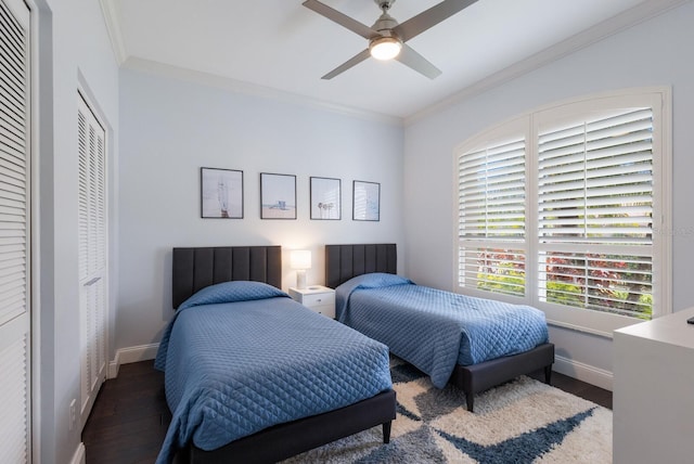 bedroom featuring crown molding, baseboards, ceiling fan, and wood finished floors