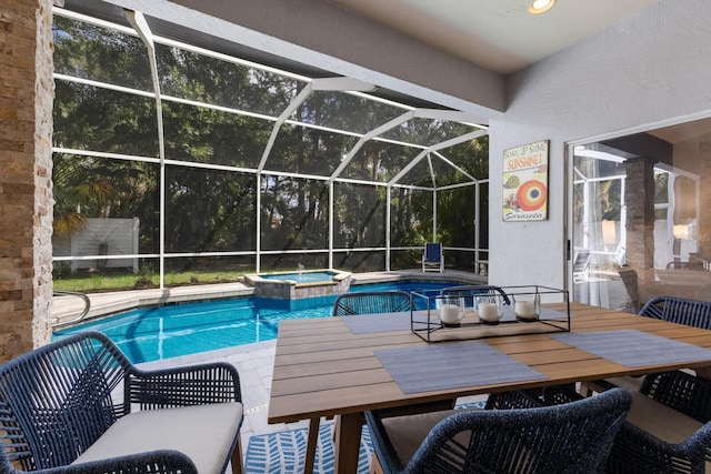 view of pool with glass enclosure, a pool with connected hot tub, outdoor dining space, and a patio area