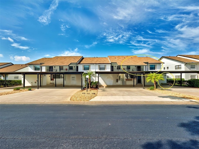 view of property with a residential view and stucco siding