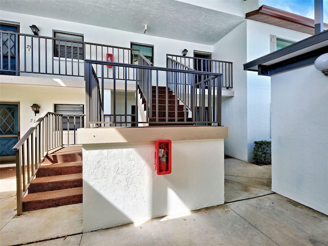 interior space with concrete floors and a textured ceiling