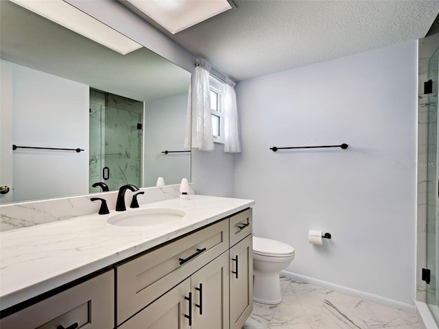 full bathroom featuring a stall shower, vanity, baseboards, toilet, and marble finish floor
