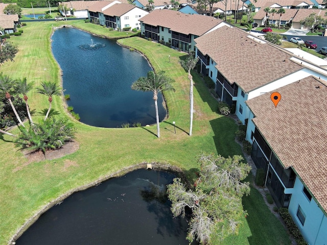 birds eye view of property with a residential view and a water view