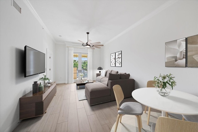 555 N Orange Ave Unit 307, Sarasota, FL 34236 - living room with crown molding, light wood-type flooring, a ceiling fan, and baseboards