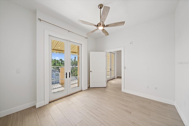 555 N Orange Ave Unit 307, Sarasota, FL 34236 - empty room featuring french doors, light wood finished floors, baseboards, and a ceiling fan