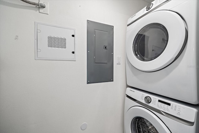 555 N Orange Ave Unit 307, Sarasota, FL 34236 - clothes washing area featuring electric panel and estacked washer and dryer
