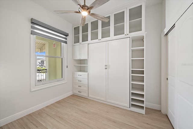 555 N Orange Ave Unit 307, Sarasota, FL 34236 - unfurnished bedroom featuring light wood finished floors and baseboards