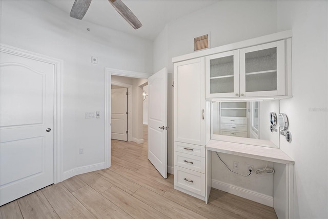 555 N Orange Ave Unit 307, Sarasota, FL 34236 - unfurnished bedroom with light wood-type flooring, baseboards, and a ceiling fan