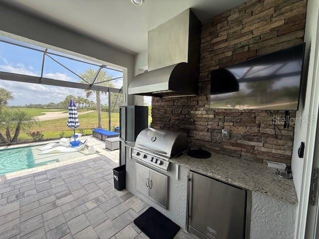 view of patio / terrace with glass enclosure, an outdoor pool, exterior kitchen, and grilling area