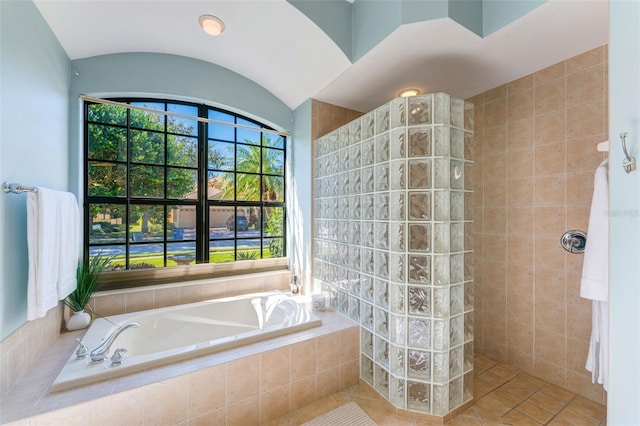 full bath with a garden tub, walk in shower, and tile patterned floors