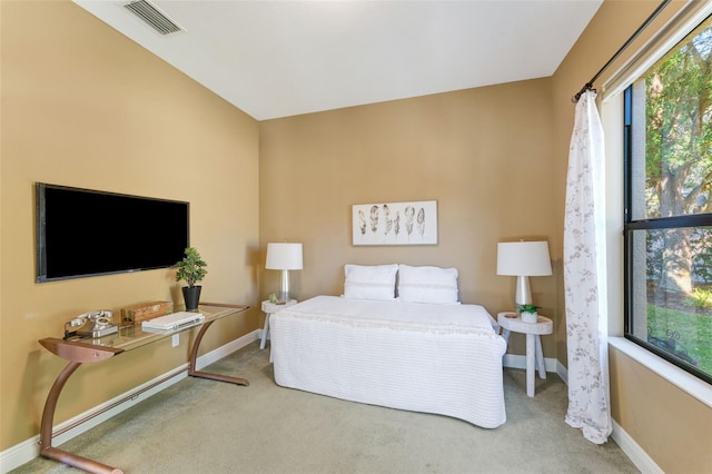 bedroom with baseboards, multiple windows, carpet flooring, and visible vents