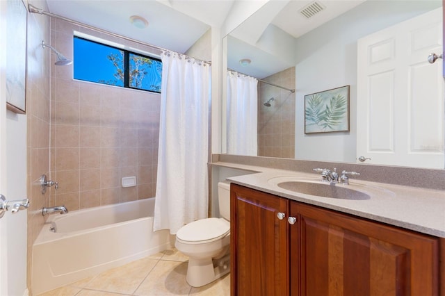 bathroom featuring visible vents, vanity, shower / bath combo with shower curtain, toilet, and tile patterned floors